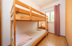 Postel nebo postele na pokoji v ubytování Cozy Apartment In Barbat Na Rabu