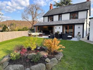 a house with a garden in the yard at Y Gorlan - Snowdonia luxury house Carneddau mountain views in Conwy