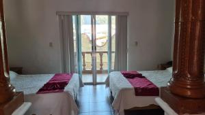 Postel nebo postele na pokoji v ubytování Hotel Leyenda del Tepozteco