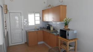 Kuchyň nebo kuchyňský kout v ubytování Maison vue mer avec piscine