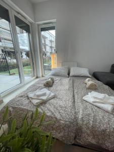 Katil atau katil-katil dalam bilik di Apartament z dużym tarasem