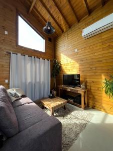 Μια τηλεόραση ή/και κέντρο ψυχαγωγίας στο Casa Hortênsia - Beira da Lagoa - Laguna-SC