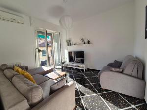 a living room with two couches and a fireplace at Rapallo Centrale in Rapallo
