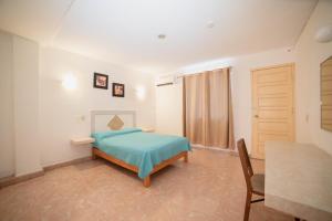 Postel nebo postele na pokoji v ubytování Hotel Rivemar