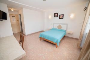 Postel nebo postele na pokoji v ubytování Hotel Rivemar