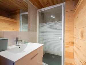 a bathroom with a shower with a sink and a mirror at Maison typique 6 pers, proche Peyragudes et Loudenvielle - FR-1-695-70 in Loudenvielle