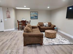 a living room with a couch and chairs and a table at Fun Florence 2 BR, close to all! in Florence