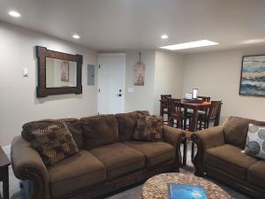 a living room with a couch and a table at Fun Florence 2 BR, close to all! in Florence