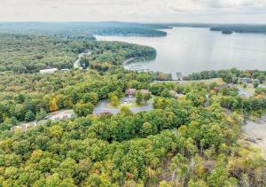an aerial view of a lake with trees at Tanglwood Resort in Hawley