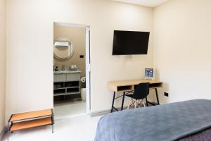TV in/ali zabaviščno središče v nastanitvi Habitación-Exclusiva-Cómoda-Centrica