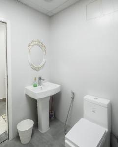 a bathroom with a sink and a toilet and a mirror at Al Damany Desert camp &Villa in Dubai +57 photos