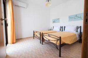 Postel nebo postele na pokoji v ubytování Twins Villas Irini & Vasiliki + 29 fotografií