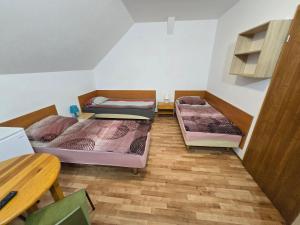 a room with three bunk beds in it at KWT Hostel Nowogard - Self Check-In - Wejscie na KOD in Nowogard