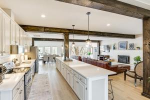 an open kitchen and living room with wooden beams at Fish, Boat and Unwind Old Hickory Lake Retreat in Nonaville