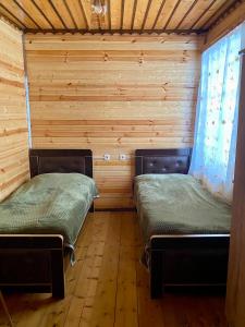 Letto o letti in una camera di Guest House Waterfall