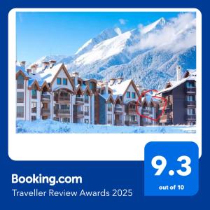 a screenshot of a hotel with snow covered mountains at Penthouse Harriet Bansko in Bansko