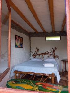 Postel nebo postele na pokoji v ubytování Eco Hotel Manu Viajeros