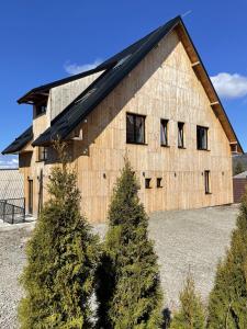 a barn with trees in front of it at Montana in Kopaonik +122 photos