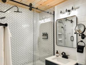 a bathroom with a shower and a sink at 200ft Fightingtown Creek Frnthot Tubarcd in Blue Ridge +49 photos