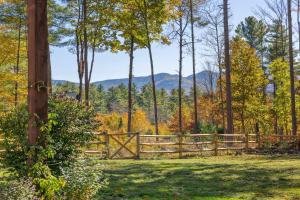 a wooden fence in the middle of a field at Luxury Retreat, Views, Near Whiteface, Lake Placid in Jay