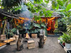 a house with a fire in front of it at Serengeti Villa in Arusha