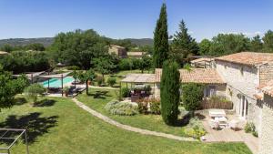 an aerial view of a villa with a garden and a swimming pool at Mas OREA in Gordes +13 photos