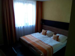 Postel nebo postele na pokoji v ubytování Hotel Trutzpfaff