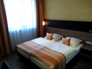 Postel nebo postele na pokoji v ubytování Hotel Trutzpfaff