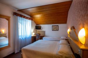 Posteľ alebo postele v izbe v ubytovaní Hotel Al Polo