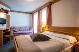 Posteľ alebo postele v izbe v ubytovaní Hotel Al Polo