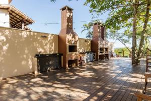 a building with two chimneys and a patio at Apto com Vista Mar a 214m da Praia - BLU0206 in Florianópolis