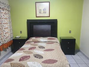 Postel nebo postele na pokoji v ubytování HOTEL BAEZA