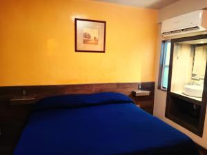 Postel nebo postele na pokoji v ubytování HOTEL BAEZA