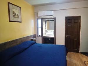 Postel nebo postele na pokoji v ubytování HOTEL BAEZA