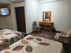Postel nebo postele na pokoji v ubytování HOTEL BAEZA
