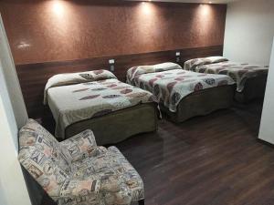 Postel nebo postele na pokoji v ubytování HOTEL BAEZA