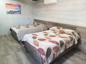 Postel nebo postele na pokoji v ubytování HOTEL BAEZA