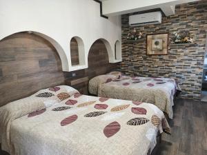 Postel nebo postele na pokoji v ubytování HOTEL BAEZA