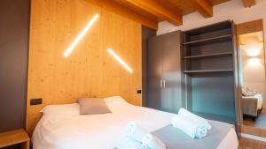 Postel nebo postele na pokoji v ubytování Appartamento Vale e Schena Cortina D'Ampezzo