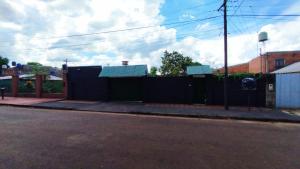 a fence on the side of a street at Cápsula 127 in Puerto Iguazú