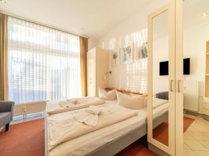 Postel nebo postele na pokoji v ubytování Elegant eingerichtete Ferienwohnung