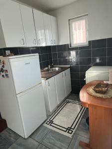 Kuchyň nebo kuchyňský kout v ubytování City Vibe + 13 fotografií