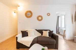 En eller flere senge i et værelse på Le Cosy des Remparts! Aigues-Mortes