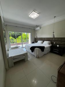Giường trong phòng chung tại Casa Fênix
