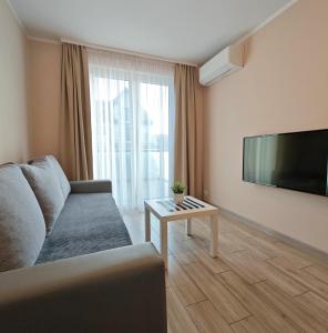 Televízia a/alebo spoločenská miestnosť v ubytovaní Marittimo Resort