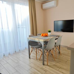 Televízia a/alebo spoločenská miestnosť v ubytovaní Marittimo Resort