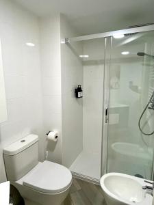 a bathroom with a shower and a toilet and a sink at Puente de la Reina de Teruel in Teruel +31 photos