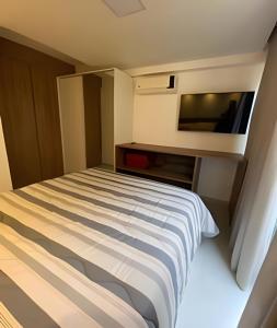 Giường trong phòng chung tại Condominio Maui Beach Residence