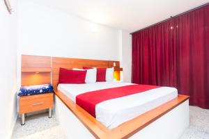 Postel nebo postele na pokoji v ubytování Hotel Bicentenario Rionegro