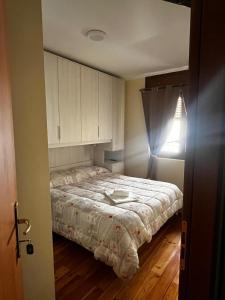 Rúm í herbergi á Albergo Eden